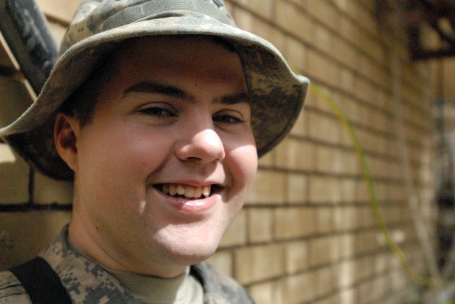 BAGHDAD - Coshocton, Ohio native, Spc. Robert Rizer enjoys a break away from the Command Information Center (CIC) at Joint Security Station War Eagle, north of Baghdad, June 11. Rizer is a Radio and Telephone Operator (RTO) for Headquarters and...