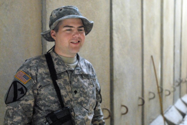 BAGHDAD - Coshocton, Ohio native, Spc. Robert Rizer enjoys a break away from the Command Information Center (CIC) at Joint Security Station War Eagle, north of Baghdad, June 11. Rizer is a Radio and Telephone Operator (RTO) for Headquarters and...