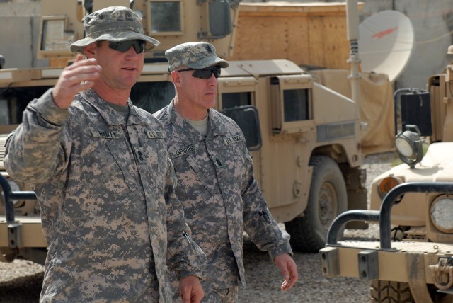 BAGHDAD - While inspecting force protection and quality of life standards at Joint Security Station Doura, here, June 11, 1st Sgt. Michael Hatley (left), an infantryman from Hope Mills, N.C., assigned to Company A, 252nd Combined Arms Battalion,...