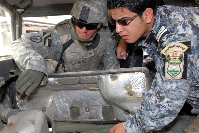 BAGHDAD - "Everything I showed them, I wanted them to also do instead of just talking to them about it," said North Wilkesboro, N.C., native, Sgt. Adam Mahaffey (left), an infantryman assigned to Company A, 252nd Combined Arms Battalion, 30th...