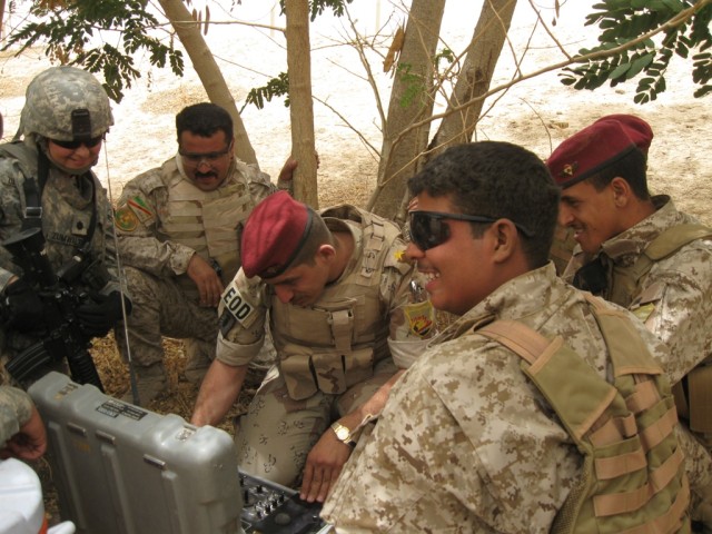 BAGHDAD-Lt. Col. Maria Zumwalt (far left), a native of Puerto Rico and commander of the 1st Brigade Special Troops Battalion, 1st "Ironhorse" Brigade Combat Team, 1st Cavalry Division, observes and discusses the effectiveness of the explosives ordnan...