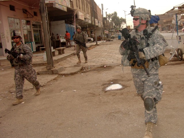 BAGHDAD –Soldiers of B Company, 252nd Combined Arms Battalion, 30th Heavy Brigade Combat Team patrol through a market place in the Saydiyah district of southern Baghdad, June 9.  During a patrol, Soldiers must balance security with politeness...