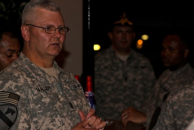 TAJI, Iraq - Attending a roof top celebration of the Army's 234th birthday as a guest of honor, Command Sgt. Maj. Rory Malloy, from Campbellsburg, Ind., division command sergeant major, 1st Cavalry Division, Multi-National Division - Baghdad,...