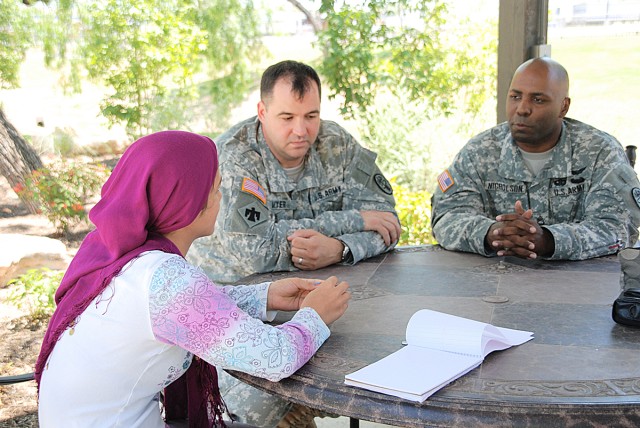 Afghan Girl talks with Soldiers