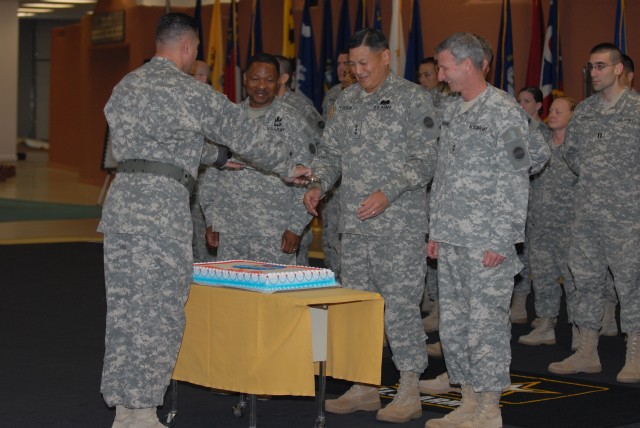 Senior leaders preparing to cut a ceremonial cake celebrating Fort Bliss&#039; TOA