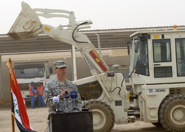 BAGHDAD - Col. Joseph Martin, a native of Dearborn, Mich., commander, 2nd Heavy Brigade Combat Team, 1st Infantry Division, Multi-National Division - Baghdad, speaks to guests attending the transfer ceremony of the Hurriyah Public Works Sub...