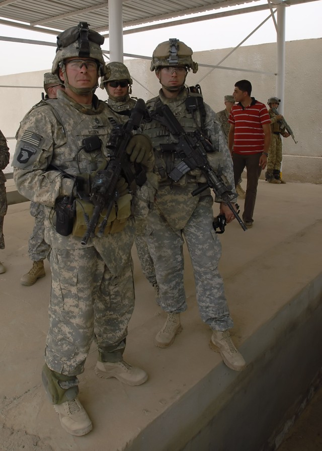 BAGHDAD - Sgt. 1st Class John Bissem (left), a native of La Crosse, Wis., and Capt. Nathan Williams, a native of Raleigh, N.C., both of the 1st Combined Arms Battalion, 18th Infantry Division, 2nd Heavy Brigade Combat Team, 1st Infantry Division,...