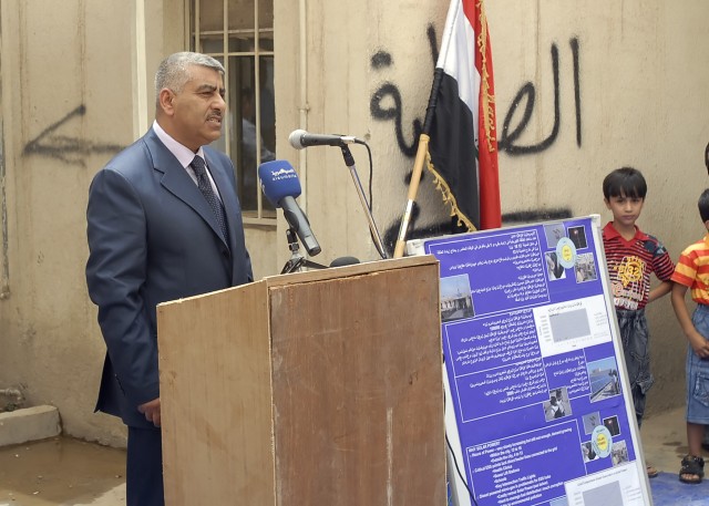 BAGHDAD - Dr. Abbas, the deputy director general of the Iraqi Ministry of Health, speaks at the reopening ceremony of the Dahkel Clinic in the Hurriyah neighborhood of northwest Baghdad June 17. The clinic recently was fixed with solar panels on...