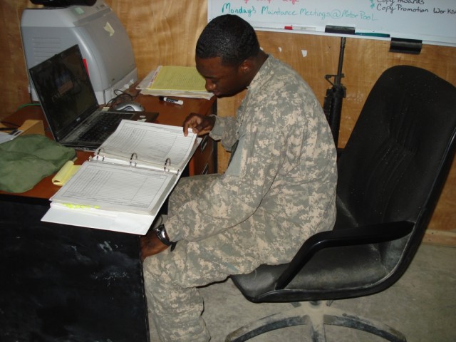 BAGHDAD - As a unit supply specialist, Spc. Aljalel Eaddy, 46th Engineer Combat Battalion (Heavy), 225th Engineer Brigade, flips through a hand-receipt book of thousands of company items and equipment.  The Gresham, S.C. native uses his...