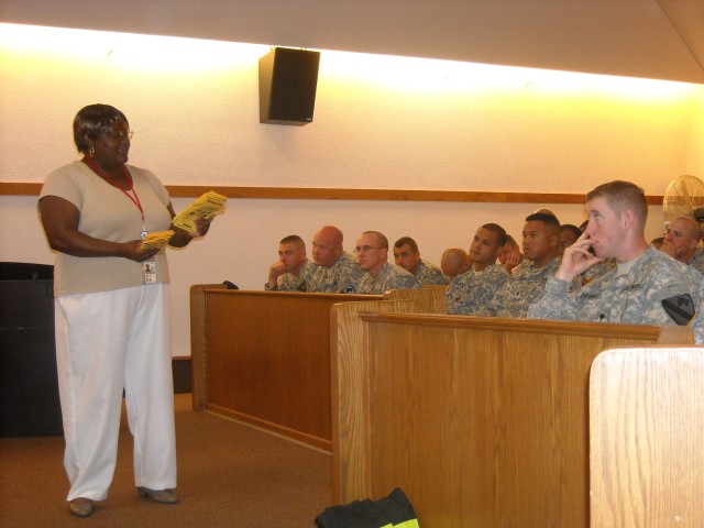 Sharon Jackson, a provider that works with the Family Advocacy Program, speaks with Soldiers assigned to the 4th Brigade Combat Team, 1st Cavalry Division, about the services that help troops adjust to being home, during the Battlemind Training...