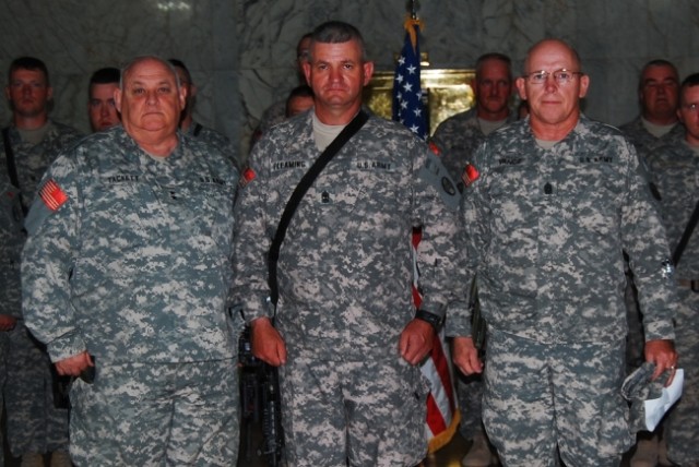 BAGHDAD - Maj. Gen. Allen Tackett (left), the West Virginia National Guard Adjutant General, and the West Virginia State Command Sgt. Maj. Lawrence Vance (right) pose for a photograph with 1st Sgt. Don Fleming of 150th Armored Reconnaissance...