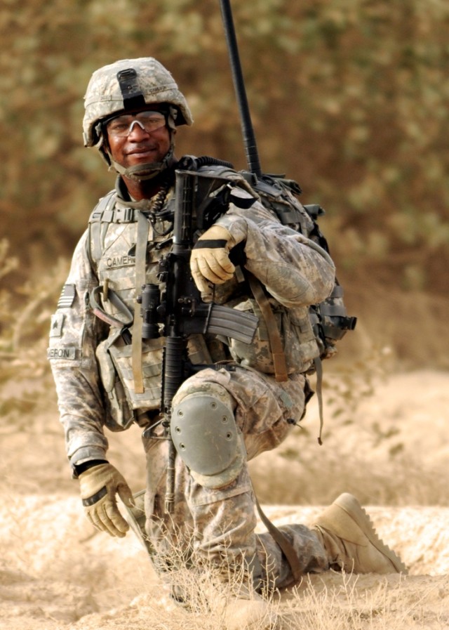 BAGHDAD - Medic Sgt. Laurence Cameron, of Battery B, 113th Field Artillery, 30th Heavy Brigade Combat Team, has been known as "Dawg Medic," since the beginning of his deployment. While on patrol south of Baghdad, June 20, Cameron of Rock Hill,...