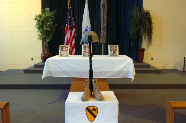 Hundreds of fellow Soldiers, friends and family members pay their last respects to Spcs. Jeremiah McCleery, Jake Velloza and Shawn Sykes, during a memorial June 19, at 1st Cavalry Division's Memorial Chapel, for three 3rd Brigade Combat Team, 1st...