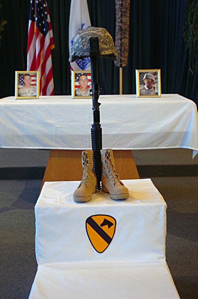 Hundreds of fellow Soldiers, friends and family members pay their last respects to Spcs. Jeremiah McCleery, Jake Velloza and Shawn Sykes, during a memorial June 19, at 1st Cavalry Division's Memorial Chapel, for three 3rd Brigade Combat Team, 1st...