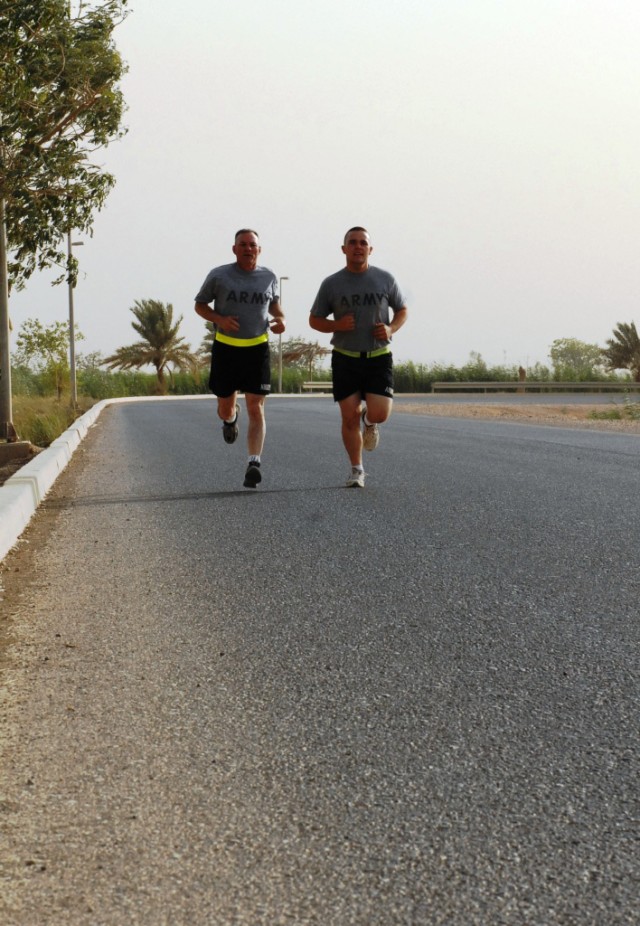 BAGHDAD - Father and son duo, Lt. Col. Jerry S. Crooks (left) and Pfc. Taylor Crooks (right), take a run together around Z Lake on Camp Liberty, June 20. Father's Day was especially meaningful as the two experienced the day in a way they never...