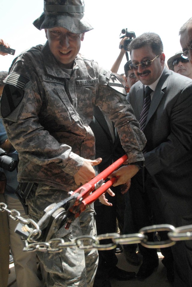 BAGHDAD - South Bend, Ind. native Lt. Col. Scott Jackson, commander, 1st "Black Knights" Battalion, 5th Cavalry Regiment, attached to the 1st Brigade Combat Team, 1st Cavalry Division and Dr. Qahtan Abaas Al-Jaburri, the minister of tourism and...