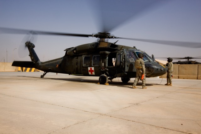 CAMP TAJI, Iraq-A crew chief, medic and two aviators run up a UH-60 Black Hawk helicopter, June 22, from C Company "Medevac," 2nd Battalion, 1st Air Cavarly Brigade, 1st Cavarly Division, to ensure every thing is working properly before assuming...