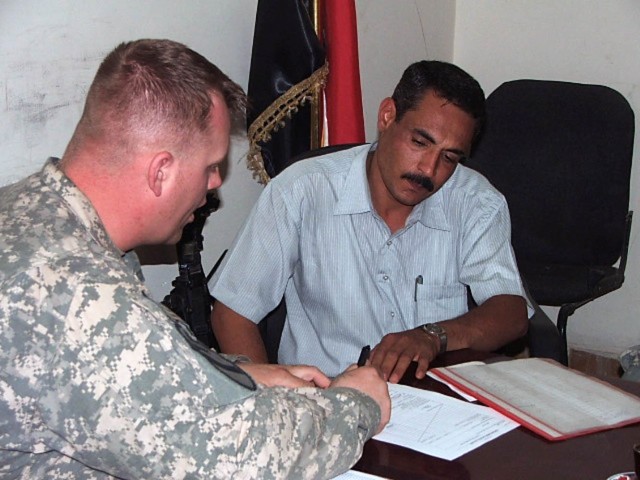 Diyala Province, Iraq - Staff Sgt. Nicholas Lien, a native of Whitewater, Wis., a Civil Affairs Team noncommissioned officer for the 1st Battalion, 82nd Field Artillery Regiment, attached to 3rd Brigade, 82nd Airbone Division, Multi-National...