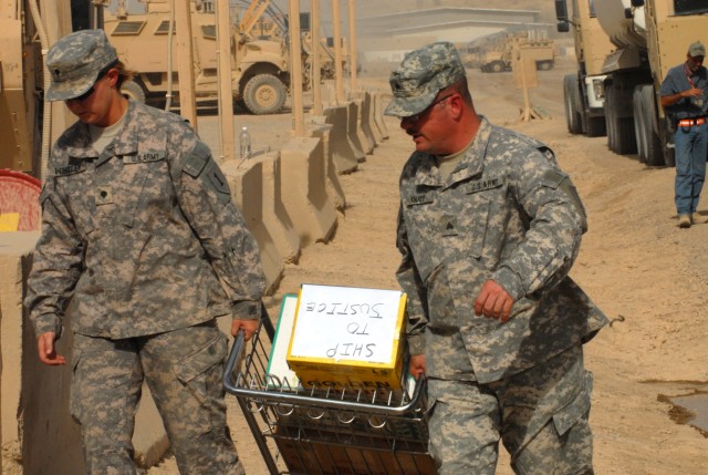 BAGHDAD - Spc. Angelica Windley (left), a supply specialist from Washington, N.C., and Sgt. William Knapp, a logistics noncommissioned officer from Richmond, Va., both of Headquarters and Headquarters Company, 299th Brigade Support Battalion, 2nd Bri...