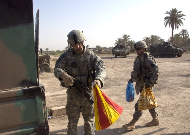 BAGHDAD - Staff Sgt. Joel Oravitz from Beaver Falls, Pa., and Spc. Mark Laird from Phoenix, Ariz., both of the 2nd Battalion, 112th Infantry Regiment, "Paxton Rangers", 2nd Heavy Brigade Combat Team, 1st Infantry Division, Multi-National Division-Bag...