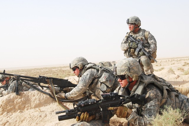 MA'DAIN REGION, Iraq - Paratroopers assigned to K Troop, 5th Squadron, 73rd Cavalry, 82nd Airborne Division, Multi-National Division - Baghdad, position themselves in order to provide support fire for their fellow Paratroopers and their Iraqi counter...