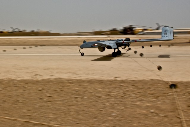 TAJI, Iraq - Returning from a reconnaissance mission, an umanned aerial vehicle from the 1st Brigade Combat Team, 1st Cavalry Division, Mutli-National Division - Baghdad, attached to the 1st Air Cavalry Brigade, 1st Cav. Div., hooks onto a cable...