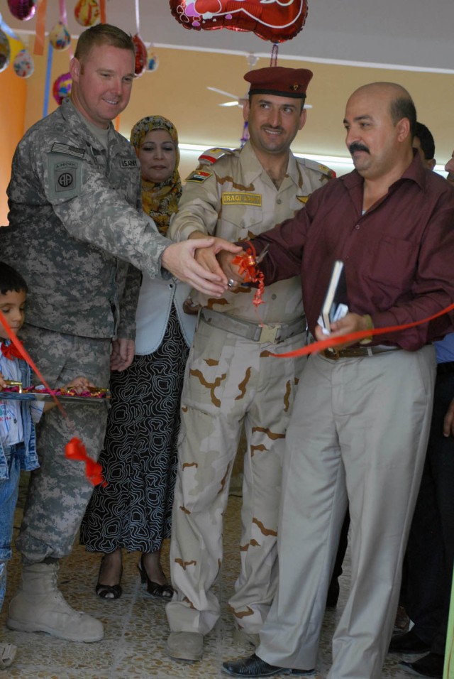 BAGHDAD -Waltham, Mass. Native Capt. William Murphy, team leader for the Civil Affairs Team attached to 1st Battalion, 5th Cavalry Regiment, attached to 1st Brigade Combat Team, 1st Cavalry Division and Iraqi Maj. Nassir from the 42nd Brigade,...