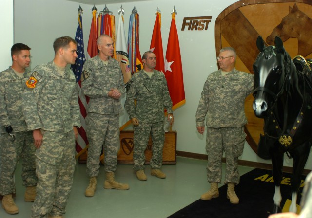 BAGHDAD - Command Sgt. Maj. Rory Malloy (right), senior enlisted advisor for 1st Cavalry Division and Multi-National Division-Baghdad, and Maj. Gen. Daniel P. Bolger (third from left), commanding general, 1st Cav. Div. and MND-B, chat with Soldiers f...