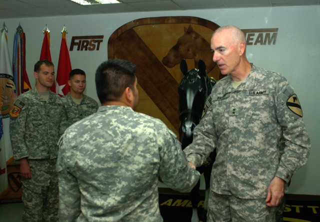 BAGHDAD - Maj. Gen. Daniel P. Bolger, commanding general for 1st Cavalry Division and Multi-National Division-Baghdad greets retired Sgt. Marco Robledo  at Camp Liberty June 27 during a visit by retired and active duty Soldiers from the pilot program...