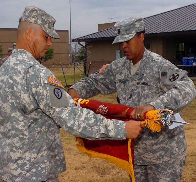 Lt. Col. Robert Villalobos, battalion commander, and Command Sgt. Maj. Vickie Hopson, battalion sergeant major, 180th Transportation Battalion, 15th Sustainment Brigade, 13th Sustainment Command (Expeditionary), case the battalion's colors during...