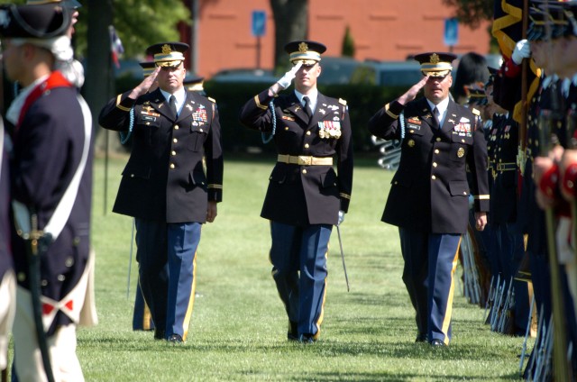 From left to right, Col. David P. Anders, incoming commander of the 3rd U.S. Infantry Regiment (The Old Guard), Lt. Col. Eric Weis, the Regimental Executive Officer and Col. Joseph P. Buche, outgoing commander, inspect the troops during the change-of...