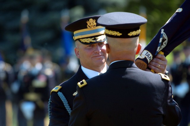 Col. David P. Anders receives the regimental colors from Brig. Gen. Karl R. Horst, the Commanding General of Joint Force Headquarters-National Capital Region and the U.S. Military District of Washington during the change-of-command ceremony...