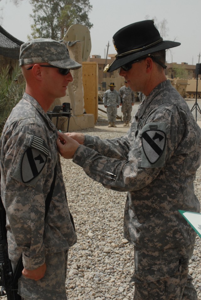 Spc. Rodney Thornton, a Houston native and gunner with Golf Forward Support Company, 3rd Battalion, 82nd Field Artillery Regiment, 2nd Brigade Combat Team, 1st Cavalry Division, has his Army Commendation Medal with V-device pinned to his chest...