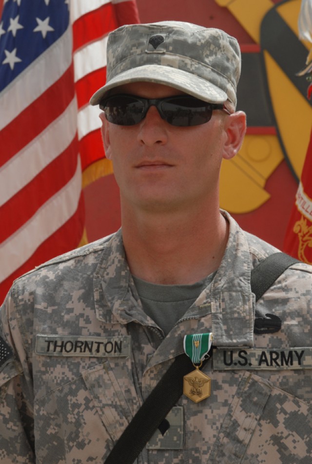 Spc. Rodney Thornton, a Houston native and gunner with Golf Forward Support Company, 3rd Battalion, 82nd Field Artillery Regiment, 2nd Brigade Combat Team, 1st Cavalry Division, stands proudly with his newly awarded Army Commendation Medal with...