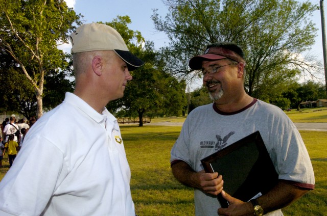Lt. Col. Mark Solomons, commander of 2nd Battalion, 8th Cavalry Regiment, 1st Brigade Combat Team, 1st Cavalry Division, of Honolulu, thanks Celebrate Killeen Committee chairman, Benton Goodnight, of Killeen, for his committee's support during...
