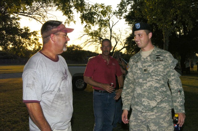 Capt. Robert Stigers, rear detachment commander of 2nd Battalion, 8th Cavalry Regiment, 1st Brigade Combat Team, 1st Cavalry Division, thanks Celebrate Killeen Committee chairman, Benton Goodnight, of Killeen, for his committee's support during...