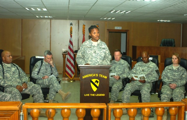 BAGHDAD -  Portsmouth, Va. native, Chief Warrant Officer 2 Tujuanna Johnson (center), legal administrator, 1st Cavalry Division, Multi-National Division-Baghdad, welcomes a crowd gathered for the dedication ceremony of the new MND-B courtroom at...