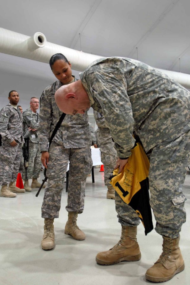 MOSUL, Iraq - Staff Sgt. Annamarie Conklin, a career counselor with 3rd "Greywolf" Heavy Brigade Combat Team, 1st Cavalry Division and a native of Santa Rita, Guam, has a football jersey signed by Gen. Ray Odierno, the commanding general for...