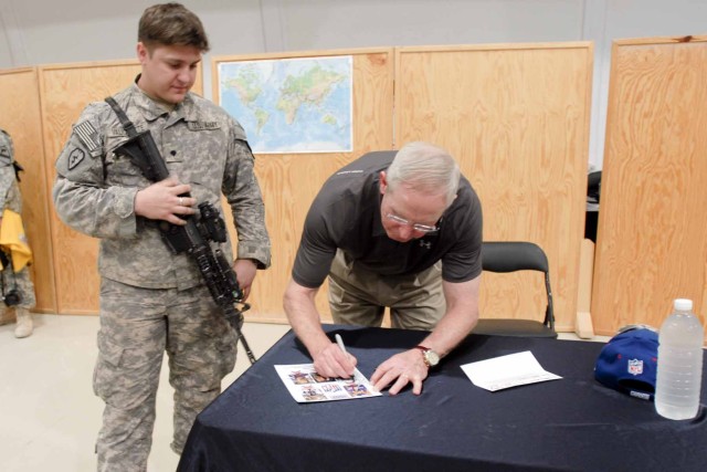 MOSUL, Iraq - Spc. Chris Valiquette, with A Co., 3rd Battalion, 8th Cavalry Regiment, 3rd "Greywolf" Heavy Brigade Combat Team, 1st Cavalry Division and a native of Weslaco, Texas has a flyer signed by Tom Coughlin, the National Football League...