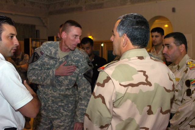 Col. Gary Volesky, the commander of the 3rd Heavy Brigade Combat Team, 1st Cavalry Division welcomes officers from all the branches of the Iraqi Security Forces at a luncheon held July 4. The event was a celebration of Independence Day and the handov...