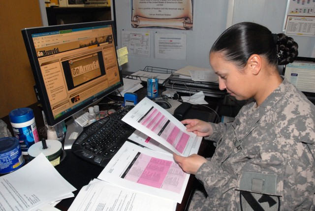 BAGHDAD - Sgt. 1st Class Julia Palma, of Lafayette, La., the budget manager for 1st Cav. Div., Multi-National Division-Baghdad, works on a statistics lesson during her lunch hour. Palma is working toward completing her Masters in Business...