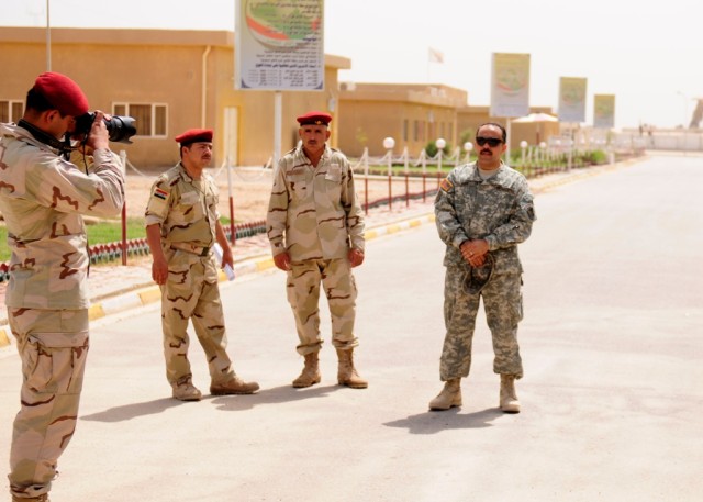 MAHMUDIYAH, Iraq - An Iraqi Soldier of the 17th Iraqi Army Division practiced basic camera techniques during a five-day public affairs class given on the IA compound here, June 22, by a sergeant with the 30th Heavy Brigade Combat Team. Four Iraqi...