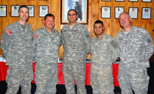 BAGHDAD - Soldiers of the 30th Heavy Brigade Combat Team's band 'Seeking Solace' are, from left: Sgt. Brian Douglas, Charlotte, N.C.; Spc. John Riggs, Kinston, N.C.; Sgt. Stephen Ortiz, Fort Meade, Md.; Pfc. Cesar Titus, Statesville, N.C.; and Sgt. D...