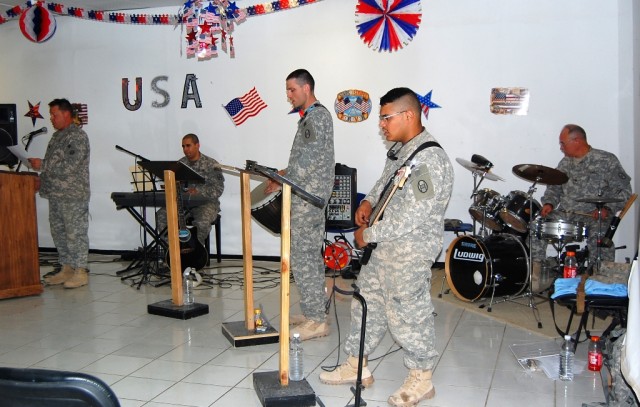 BAGHDAD - Seeking Solace, a band comprised of 30th Heavy Brigade Combat Team Soldiers performs for a crowd of about 50 people at a July Fourth prayer luncheon on Forward Operating Base Falcon. The band members, who were musicians for churches back ho...