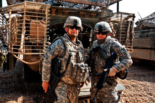 TAJI, Iraq - Col. Marc Ferraro (left), commander, 56th Stryker Brigade Combat Team of the Pennsylvania National Guard, Multi-National Division - Baghdad, and Col. Douglas Gabram, commander, 1st Air Cavalry Brigade, 1st Cavalry Division, MND-B,...