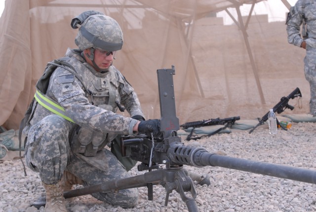 Spc. John Crowson, a Vanville, Va., native and an artilleryman with Battery B, 3rd Battalion, 82nd Field Artillery Regiment, 2nd Brigade Combat Team, 1st Cavalry Division, displays his knowledge of the 50 Caliber Machine Gun during a competition for ...