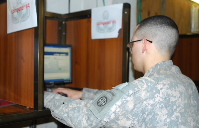 BAGHDAD - Spc. Justin Matos, of Miami, logs on to his Facebook account July 17 at the Joint Security Station Loyalty, Iraq internet center in eastern Baghdad. Matos, a communication specialist assigned to the brigade's Headquarters and...