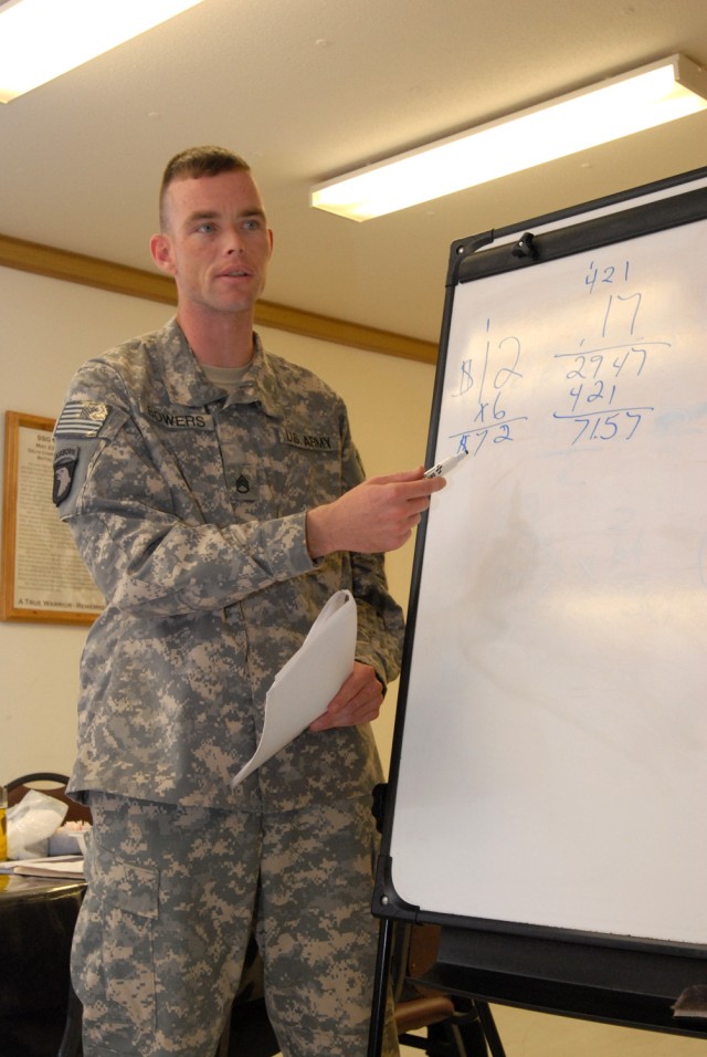 BAGHDAD - Staff Sgt. Kyle Bowers, the counter-improvised explosive device noncommissioned officer for the operations section of Company A, Division Special Troops Battalion, 1st Cavalry Division, shows the rest of the class how he got the answer...