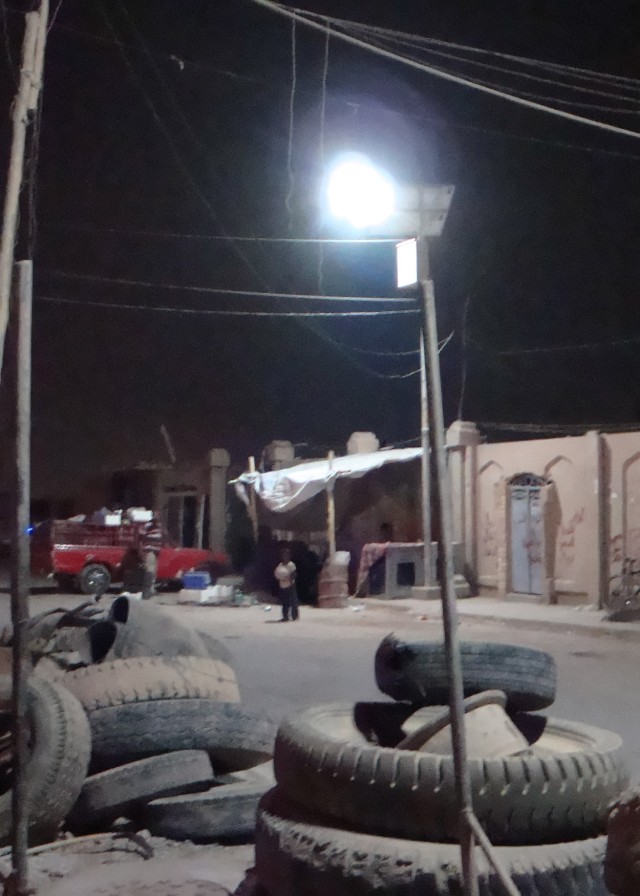 BAGHDAD - A streetlight illuminates the surrounding area in the Kadamiyah district of northwest Baghdad July 12. As directed by the 2nd Heavy Brigade Combat Team, 1st Infantry Division, Multi-National Division - Baghdad, local Iraqi contractors...