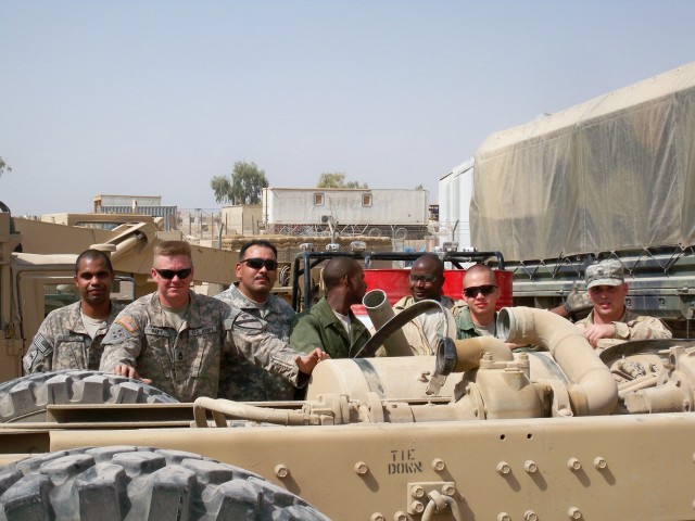 (From left to right) Sgt. Carlos Marin, Sgt. 1st Class John Riley, Staff Sgt. Federico Alcaraz, Spc. Javeed Thomas, Pfc. Larry Hankinson, Pfc. Kevin McCollough, and Pfc. Jared Geml of Bravo Field Maintenance Company, 215th Brigade Support...